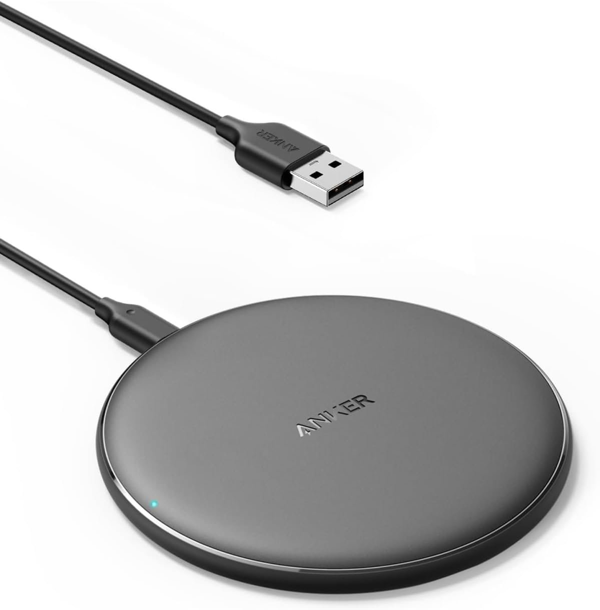Black round Anker 313 Qi wireless charging pad with a Micro-USB input cable and no phone on it.