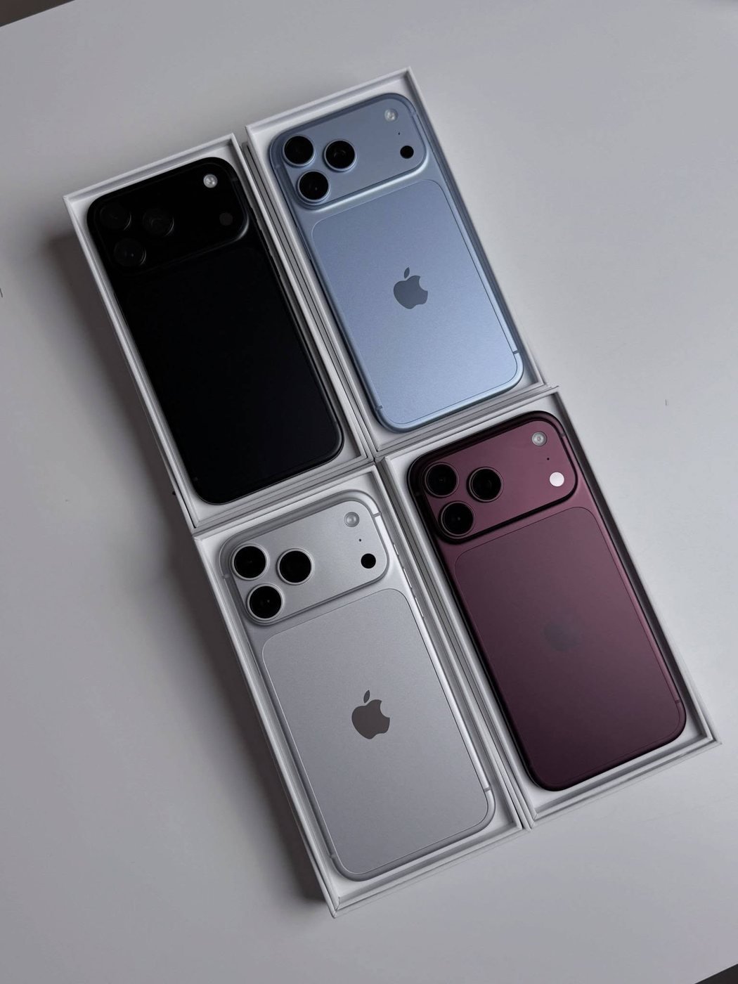 All four iPhone 18 Pro Max finishes in their open retail boxes: black, glacier, silver and burgundy
