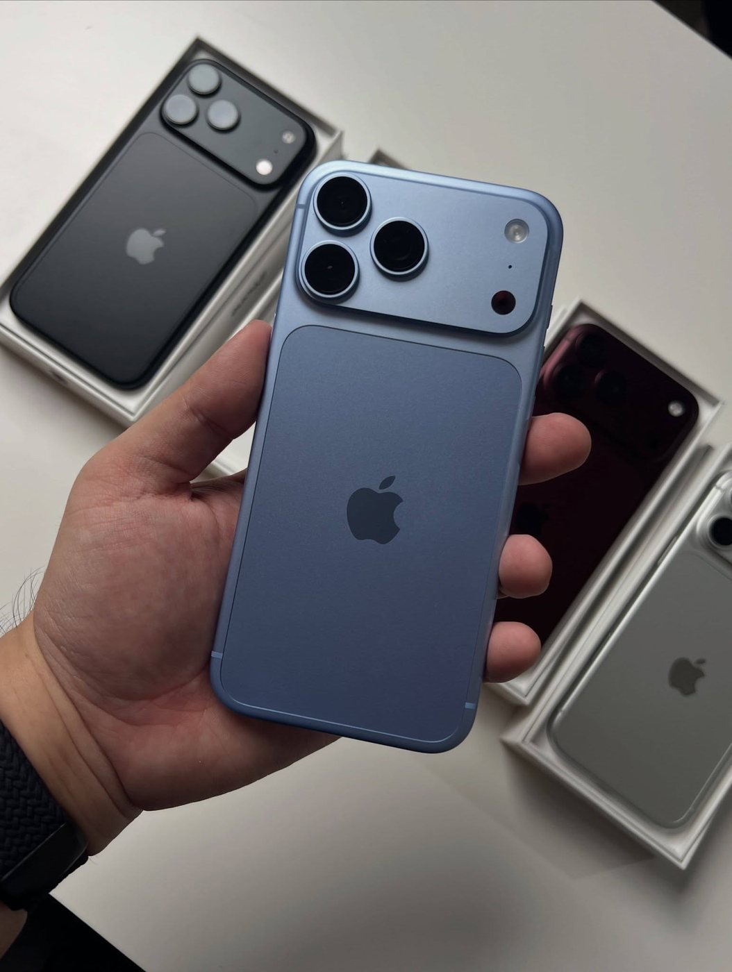Glacier blue iPhone 18 Pro Max held in one hand