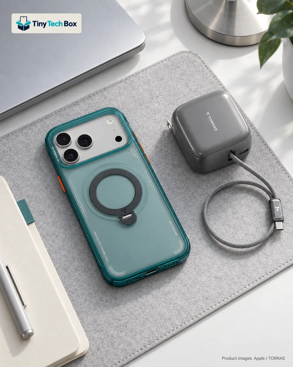 Silver iPhone 18 Pro Max in a translucent teal Glacier Sprint TORRAS Q3 Air case beside a graphite grey TORRAS FlexLine Pro charger on a light grey felt desk pad